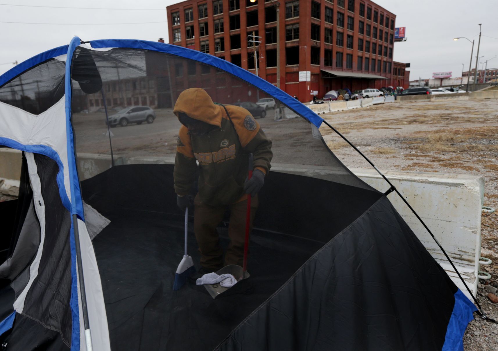 Tent encampment outside vacant McGuire Moving & Storage building